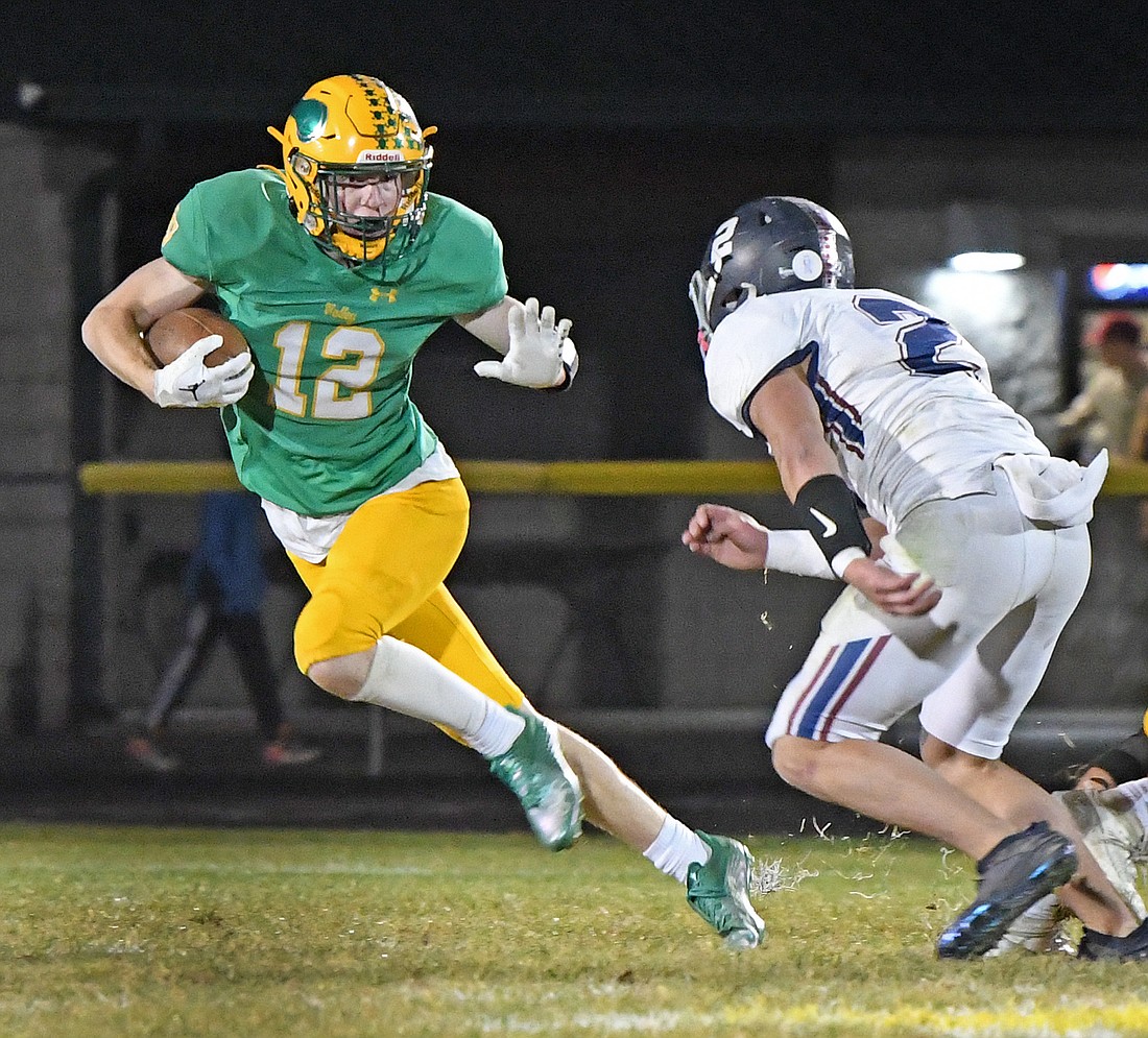 Tippecanoe Valley junior Wes Parker fends off Garrett's Calder Hefty during the first half...Nieter