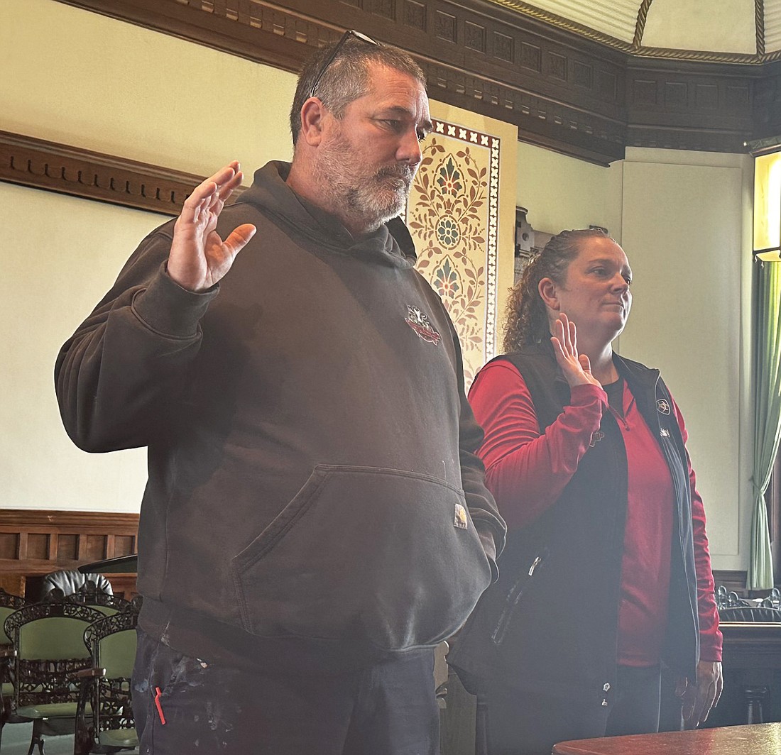 Christy (R) and David (L) Owens, owners of Owens Family Farm LLC, doing business as Owens Fresh Meat Market, are sworn in Thursday at the Kosciusko County Alcohol Commission meeting. Photo by David Slone, Times-Union