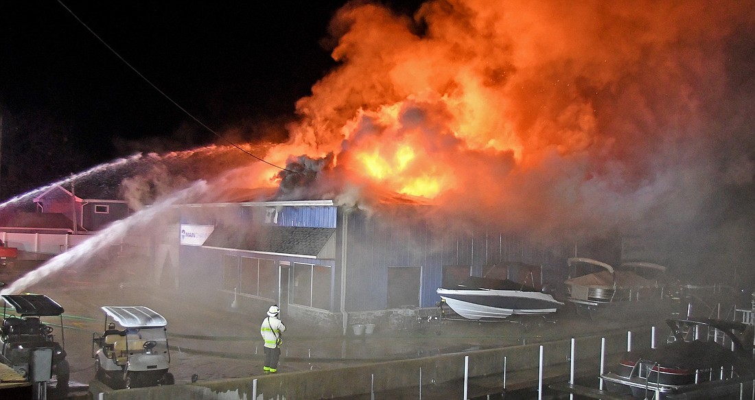 Multiple fire departments responded to Thursday morning's fire at the Main Channel Marina in Syracuse. Photo by Gary Nieter, Times-Union.