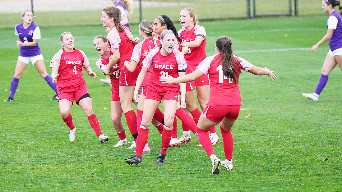 Pictured is Grace's women's soccer team celebrating a goal during the team's win on Wednesday.