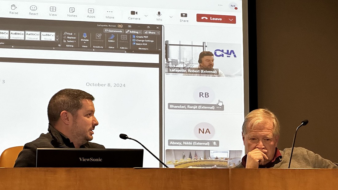 Warsaw Board of Aviation Commissioners President Jay Rigdon (R) listens to Warsaw Municipal Airport Manager Nick King (L) during Tuesday’s meeting. Photo by David Slone, Times-Union.