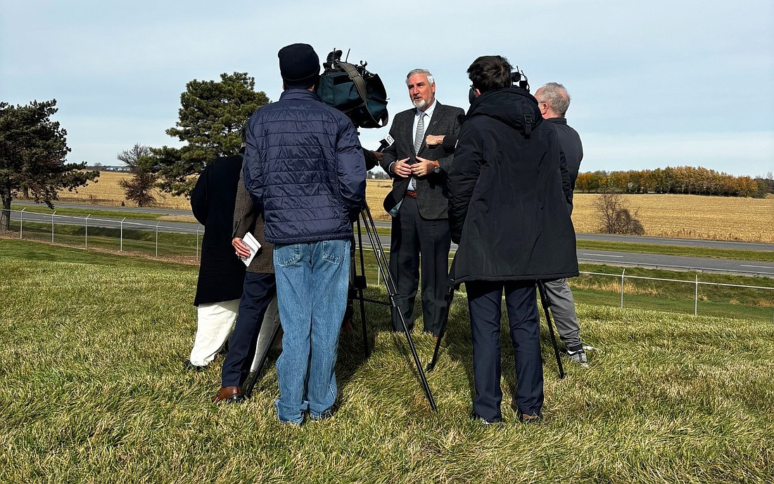 Indiana Gov. Eric Holcomb talks to reporters Wednesday about U.S. 30. Photo by Rob Parker.