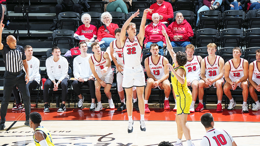 Pictured is Cole Hayworth hitting a 3-pointer during Grace's rout of Michigan-Dearborn on Tuesday