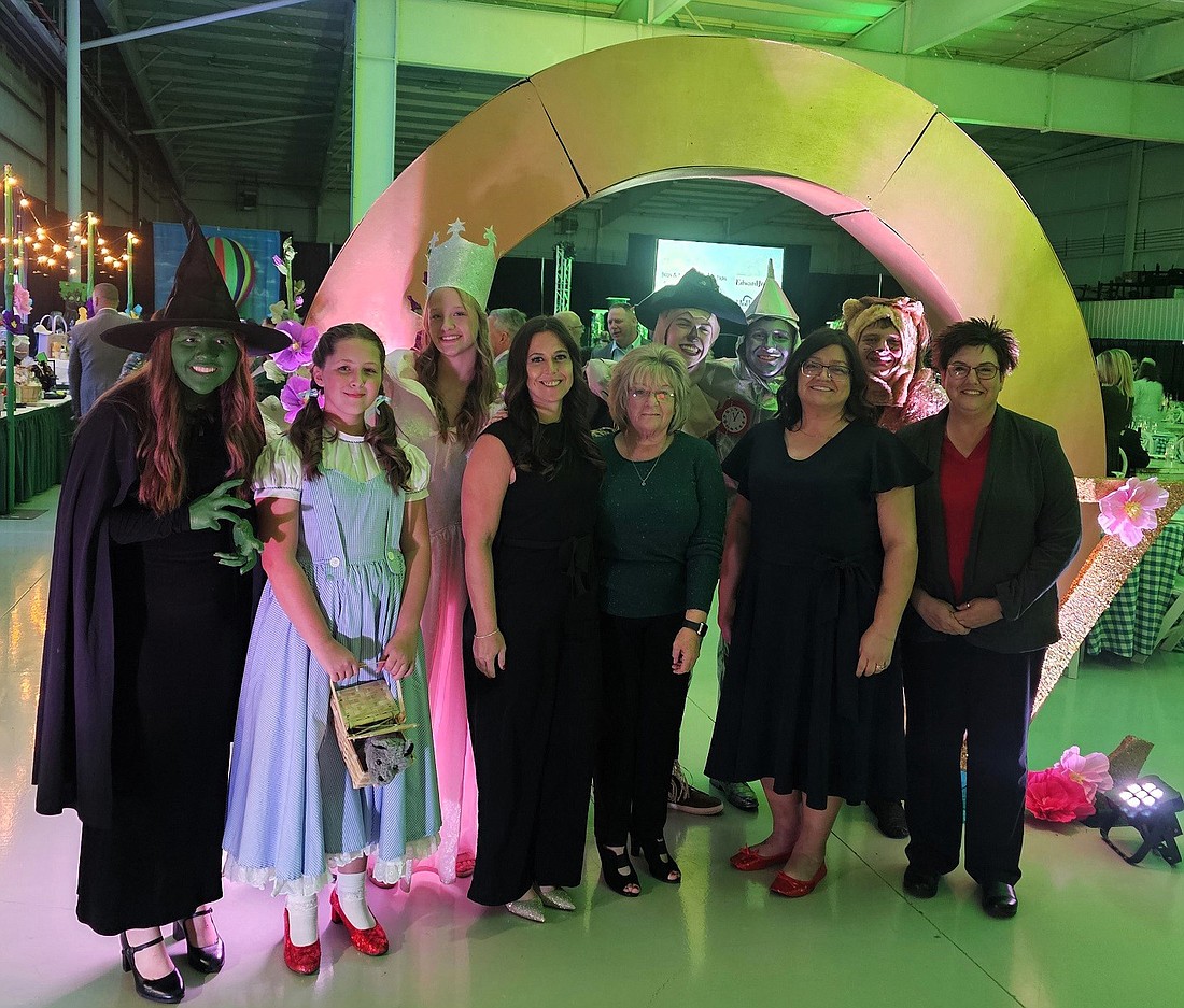 A group of attendees from Lake City Bank along with characters from “The Wizard of Oz.” Photo Provided.