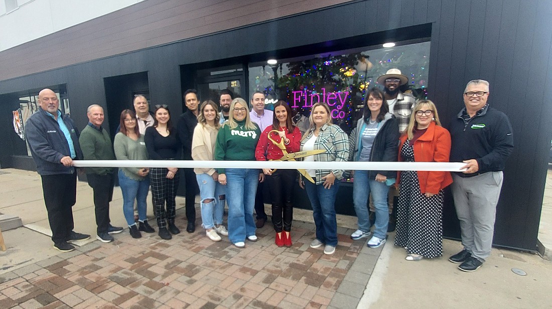 Pictured are Finley & Co. staff, friends and family and Kosciusko Chamber of Commerce staff and ambassadors. Photo by Jackie Gorski, Times-Union