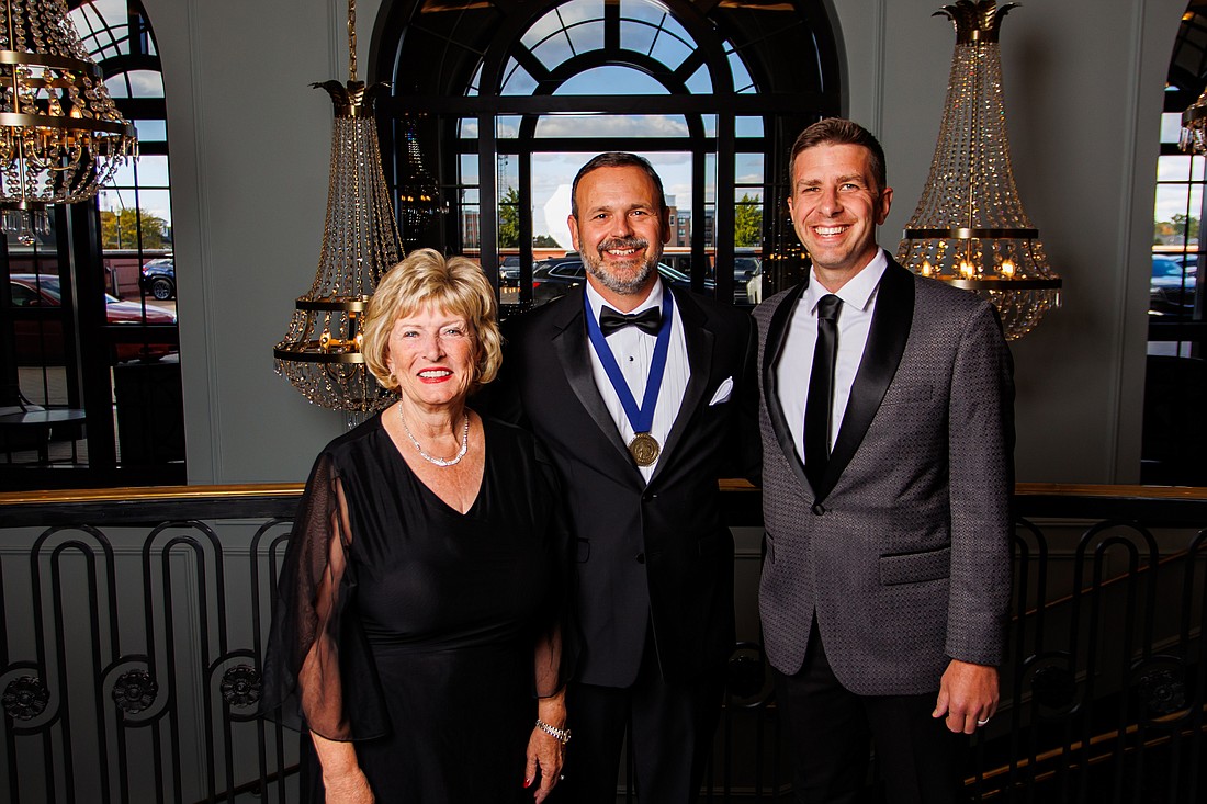 Rex D. (RD) Schrader II (C) was nominated by Dr. Sherilyn Emberton (L) and Dr. Drew Flamm (R) to be inducted into the Indiana Academy. Photo Provided.