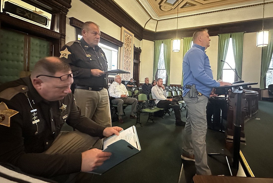 The Kosciusko County Sheriff’s Office made several requests to the county commissioners Tuesday. Pictured is Det. Lt. Josh Spangle (R) asking permission to apply for a grant for drones while Sheriff Jim Smith (L) and Chief Deputy Chris McKeand listen. Photo by David Slone, Times-Union