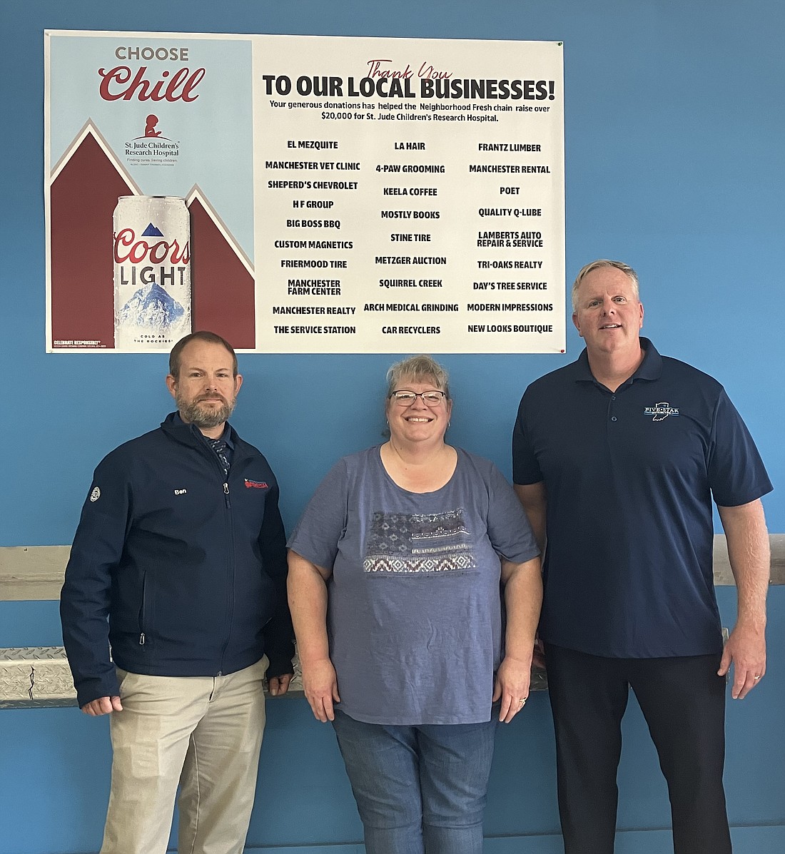 Pictured (L to R) are Neighborhood Fresh, North Manchester, store manager Ben Eilts, employee Regina Harris and Jay Solloway from Five Star Distributing. Photo Provided.