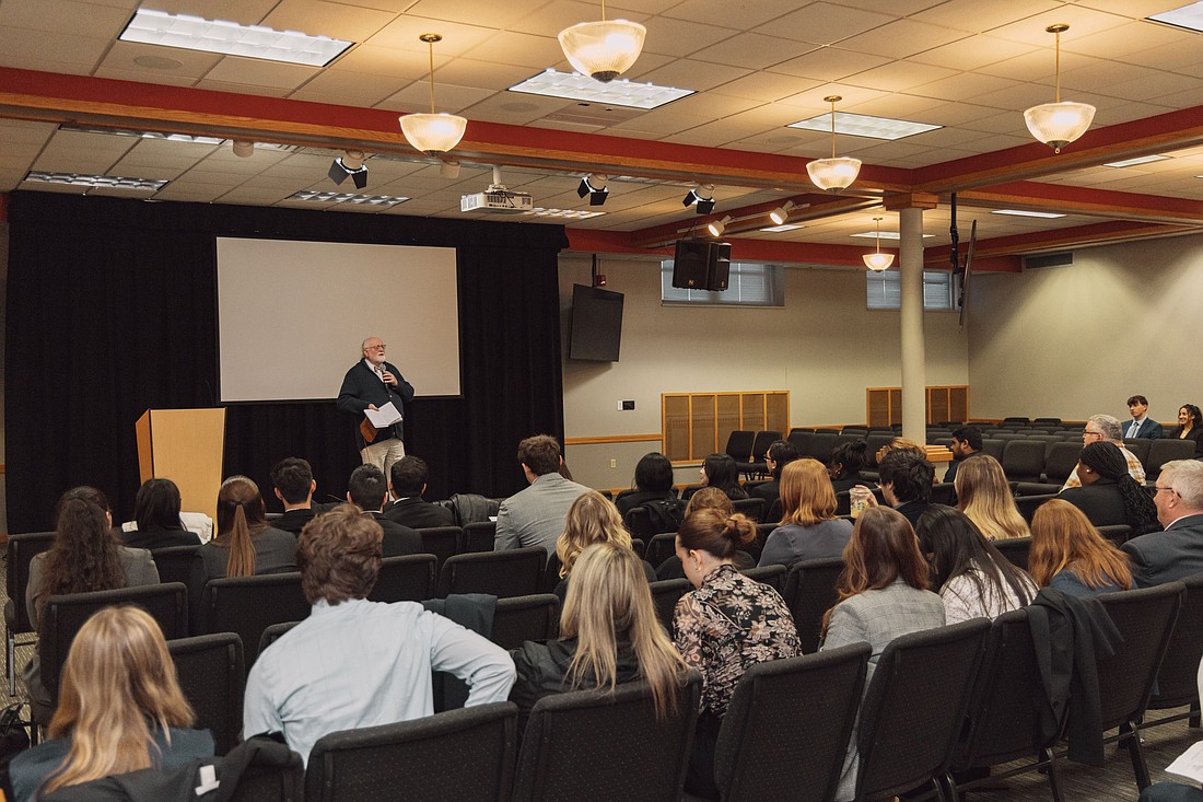 Dr. Mark Norris, professor of European and world history at Grace, speaks to the International Intercollegiate Mediation Tournament (IIMT) participants on the Grace College campus.  Photo Provided