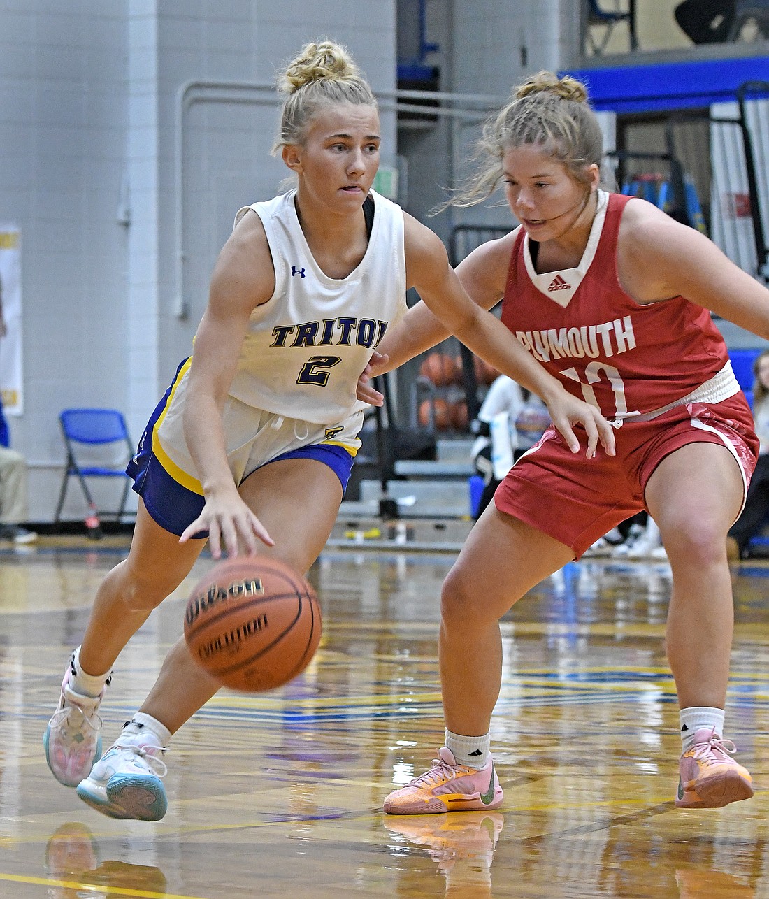 Triton junior Sierra Hawley brings the ball upcourt as Tynley Gantz of Plymouth defends...Nieter