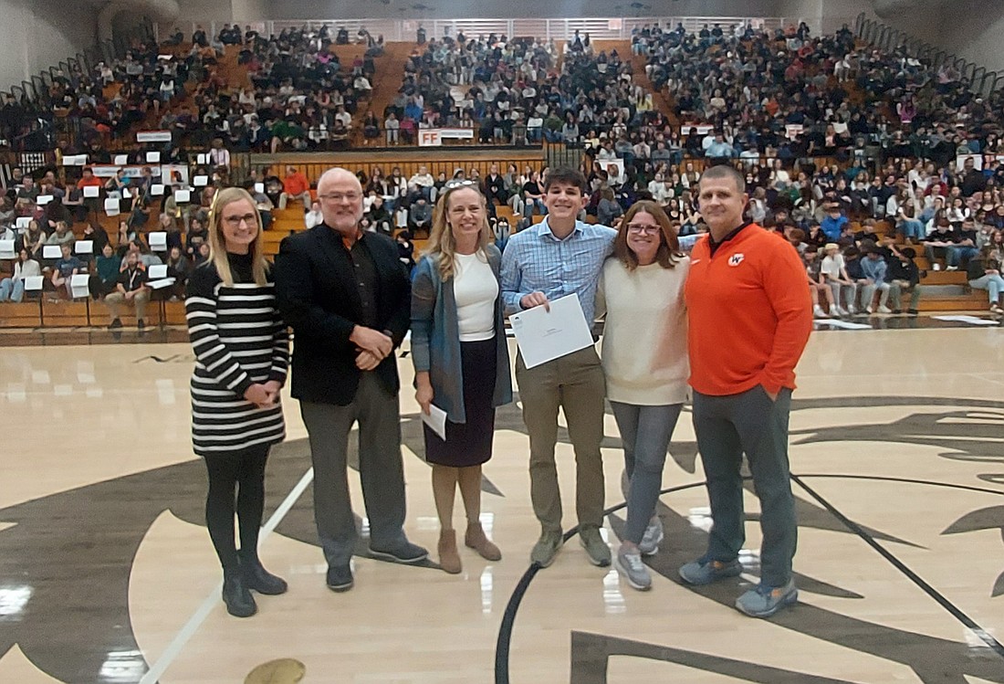 Finn Bailey (third from right) became the first recipient of the Rick and April Sasso Family Scholarship Thursday. Photo by Jackie Gorski, Times-Union