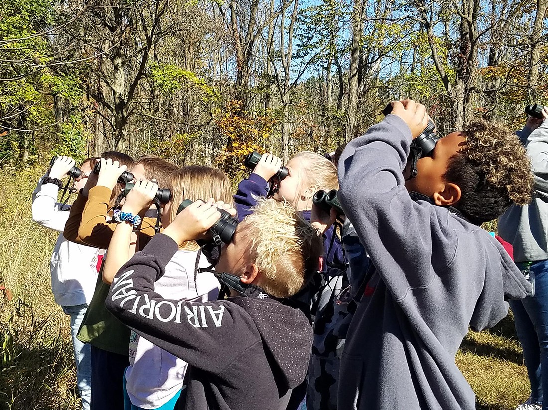 Fourth-grade students from Claypool Elementary spot a bird.Photo Provided.