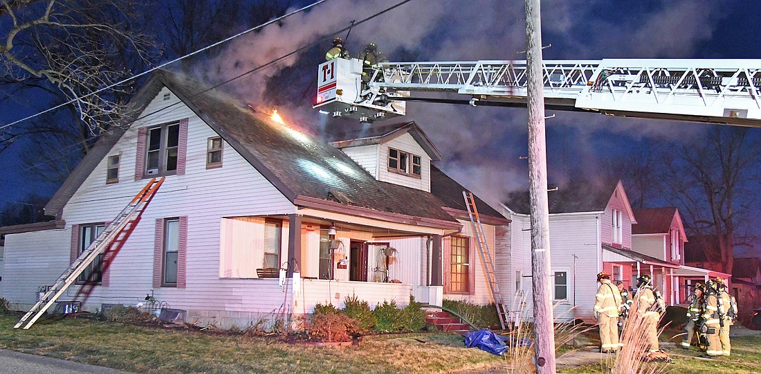 Multiple fire departments responded to Saturday's early morning house fire on Columbia Street, near Porter Street. Photo by Gary Nieter, Times-Union