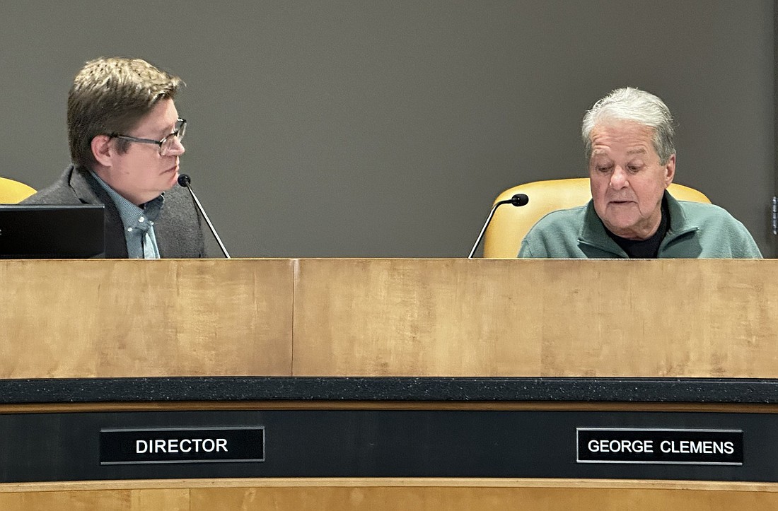 Warsaw Redevelopment Commission President George Clemens (R) listens to Warsaw Community and Economic Development Director Jeremy Skinner explain the new loan program from the Indiana Finance Authority on Monday. Photo by David Slone, Times-Union