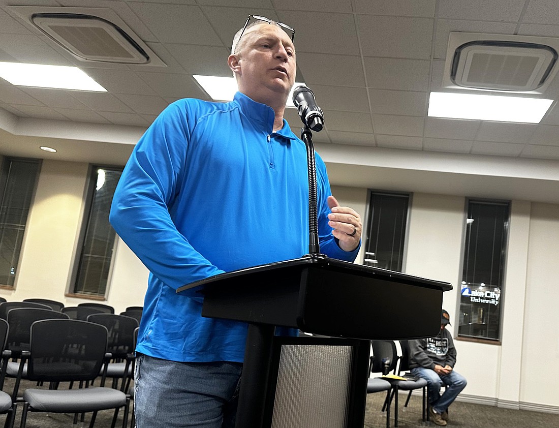 Warsaw Human Resource Director Denny Harlan explains to the Warsaw Common Council on Monday that the firefighters voted in favor of a resolution against going to a merit board system. Photo by David Slone, Times-Union