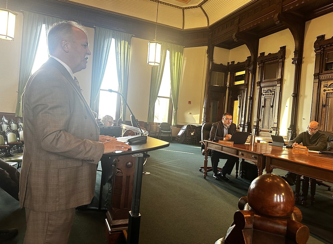 Kosciusko County Prosecuting Attorney’s Office Chief Deputy Dan Hampton (L) requests permission from the county commissioners to apply for a grant for surveillance equipment. Photo by David Slone, Times-Union