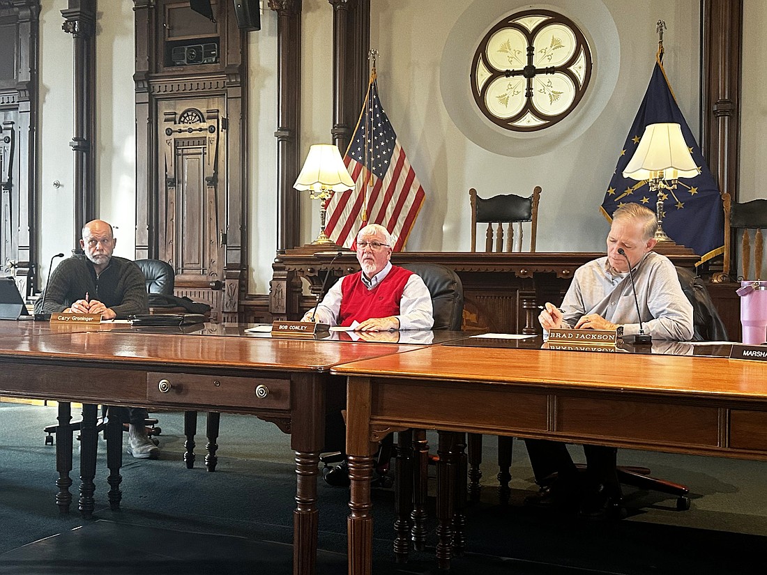 Kosciusko County Commissioners (L to R) Cary Groninger, Bob Conley and Brad Jackson hears details about the Chinworth Trail Extension project bid Tuesday. Photo by David Slone, Times-Union