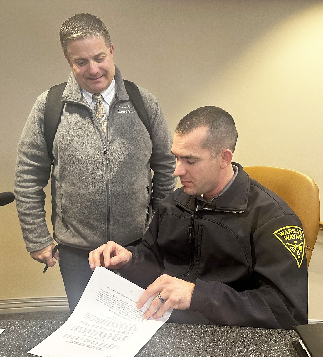 Warsaw-Wayne Fire Territory attorney Andrew Grossnickle (L) answers a question for WWFT Fire Chief Joel Shilling (R) Tuesday after the fire territory board meeting. Photo by David Slone, Times-Union