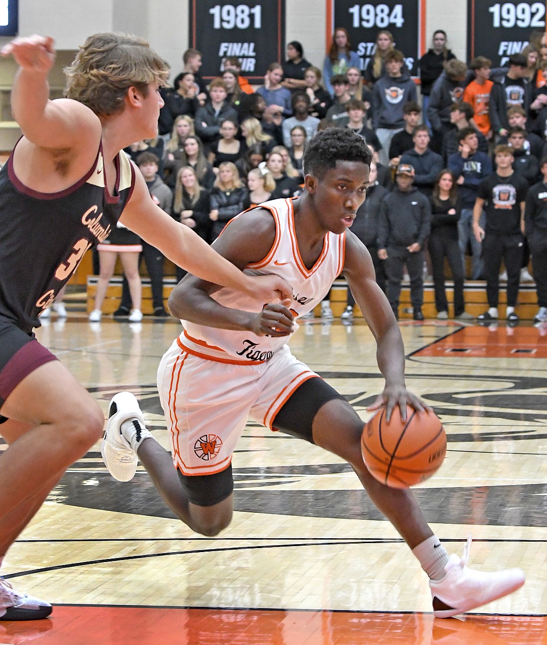 Warsaw junior Mydin Burgher makes a cut down the lane during the second quarter of Tuesday night's home game against Columbia City...Nieter