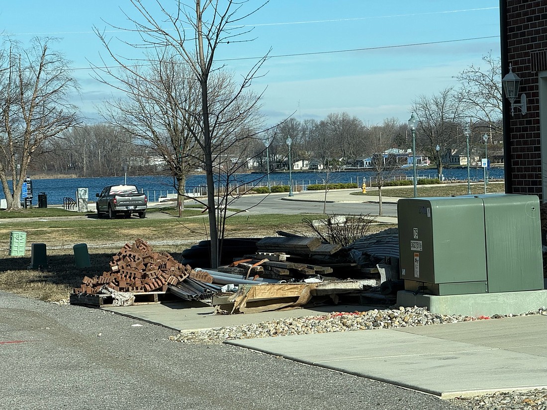 Pictured is the debris at the North Buffalo Street property that Matthews LLC moved from the lot to the driveway. Photo by Madison Hart, InkFreeNews