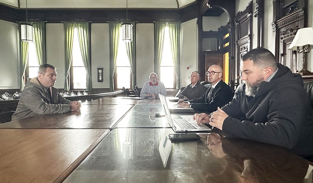 Burl Haywood (L) explains the violation Warsaw Bowl received in February to Kosciusko Alcohol Board members Dan Woods, Mike Hall, President Alan Alderfer and Indiana State Excise Police officer Daniel Vredenburg Jr. Photo by David Slone, Times-Union