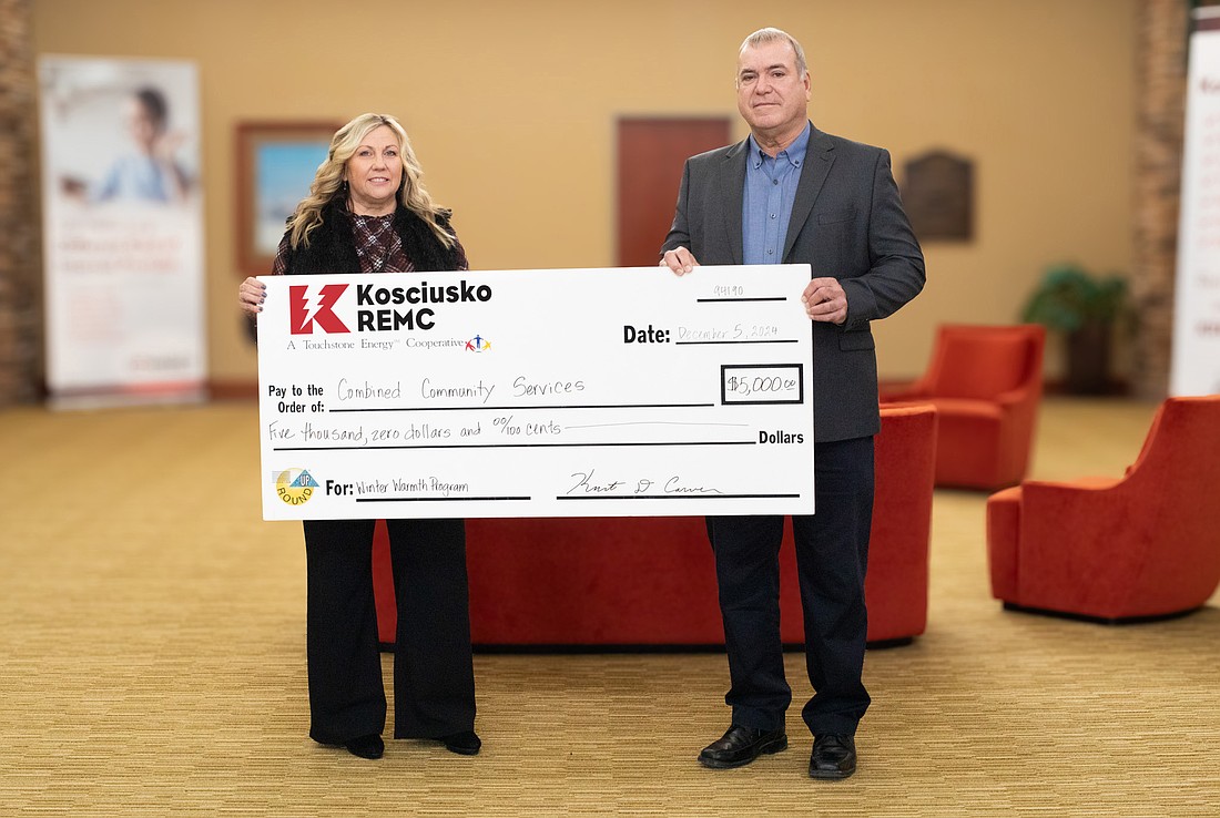 Kosciusko REMC CEO Kurt Carver presents Combined Community Services with a $5,000 check. Pictured (L to R) are Sabrina Phillips, interim executive director, CCS; and Kurt Carver, president and CEO of KREMC. Photo Provided