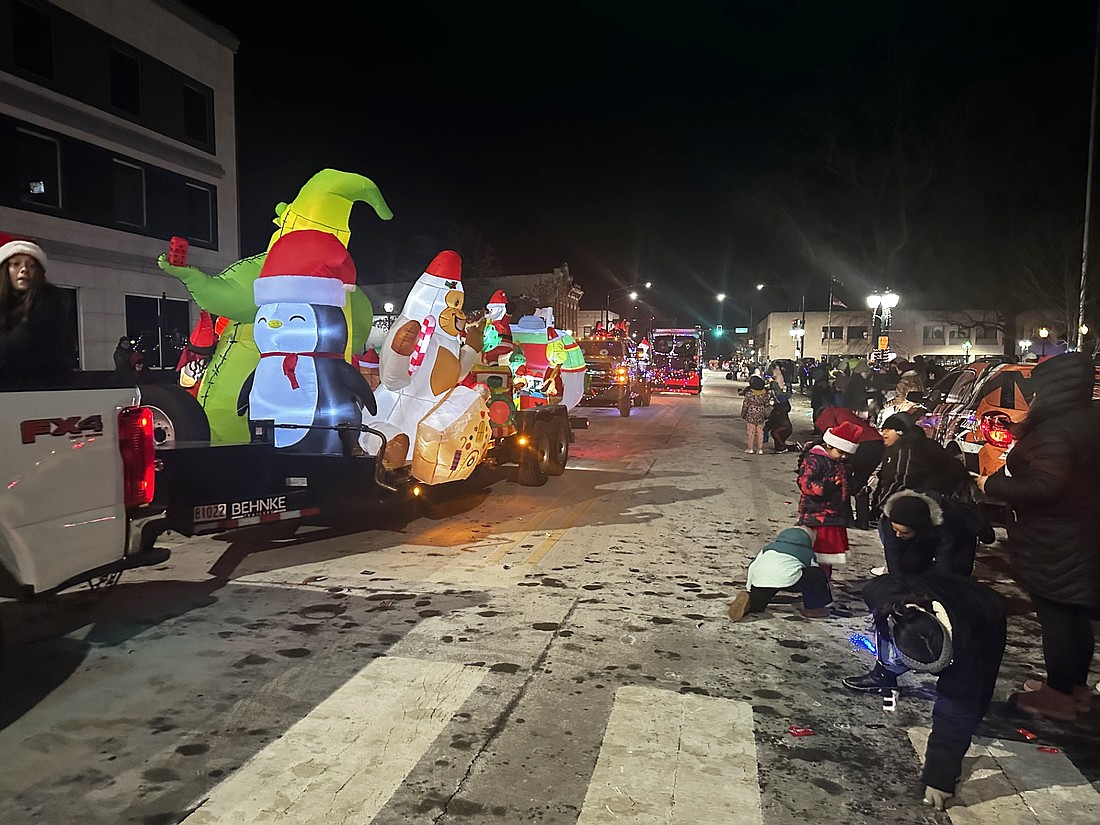 Those at the Twinkle Light Parade not only got to see one of the longer parades in recent memory, but also got their hands on some candy as it was thrown out to them. Photo by David Slone, Times-Union