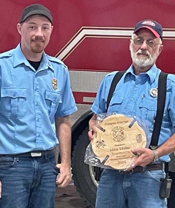 Mike Weller (R) receives his Firefighter of the Year award from Silver Lake Volunteer Fire Department Assistant Chief Addison Allen. Photo provided.