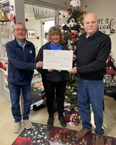 Pictured (L to R) are John Lantz, Animal Welfare League Board president; Tonya Blanchard, AWL executive director; and Mike Clabaugh, Fort Wayne Beagle Club president. Photo Provided.