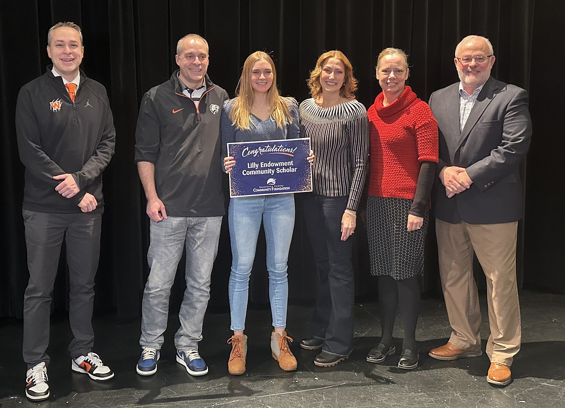 Warsaw Community High School senior Aliah Barkey learned she is one of two Lilly Endowment Community Scholarship recipients this year. Pictured (L to R) are Warsaw Community Schools Superintendent Dr. David Hoffert; Ben Barkey, Aliah’s father; Aliah; Dani Barkey, Aliah’s mother; Kosciusko County Community Foundation CEO Stephanie Overbey; and WCHS Principal Troy Akers. Photo by David Slone, Times-Union.