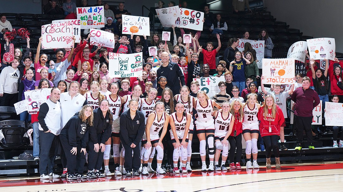 Pictured is the Grace women’s basketball team with fans, most of them elementary students, after Friday afternoon’s win over Cleary.