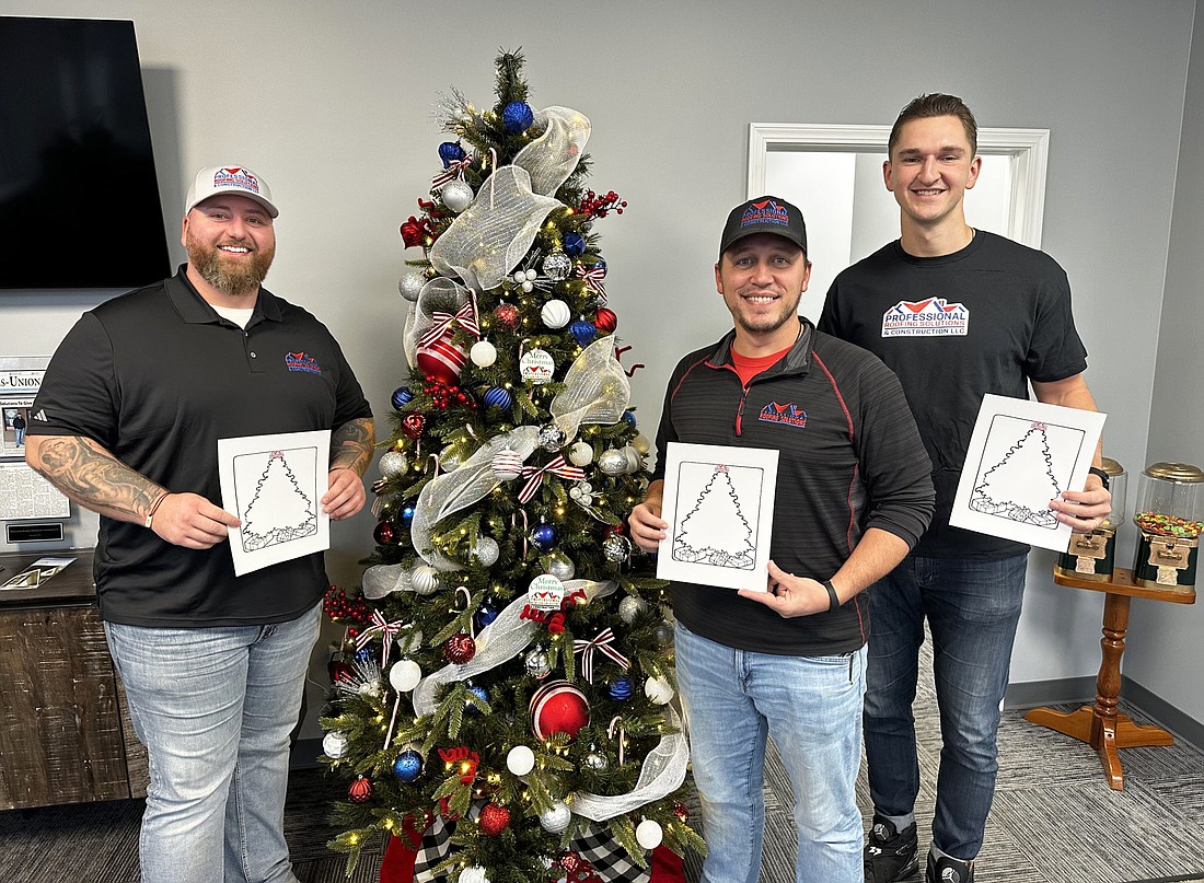 Pictured (L to R) are Brandon Blair, owner of Professional Roofing Solutions & Construction LLC; Taylor Temple, sales manager; and Paul Foreman, marketing director. Photo by David Slone, Times-Union