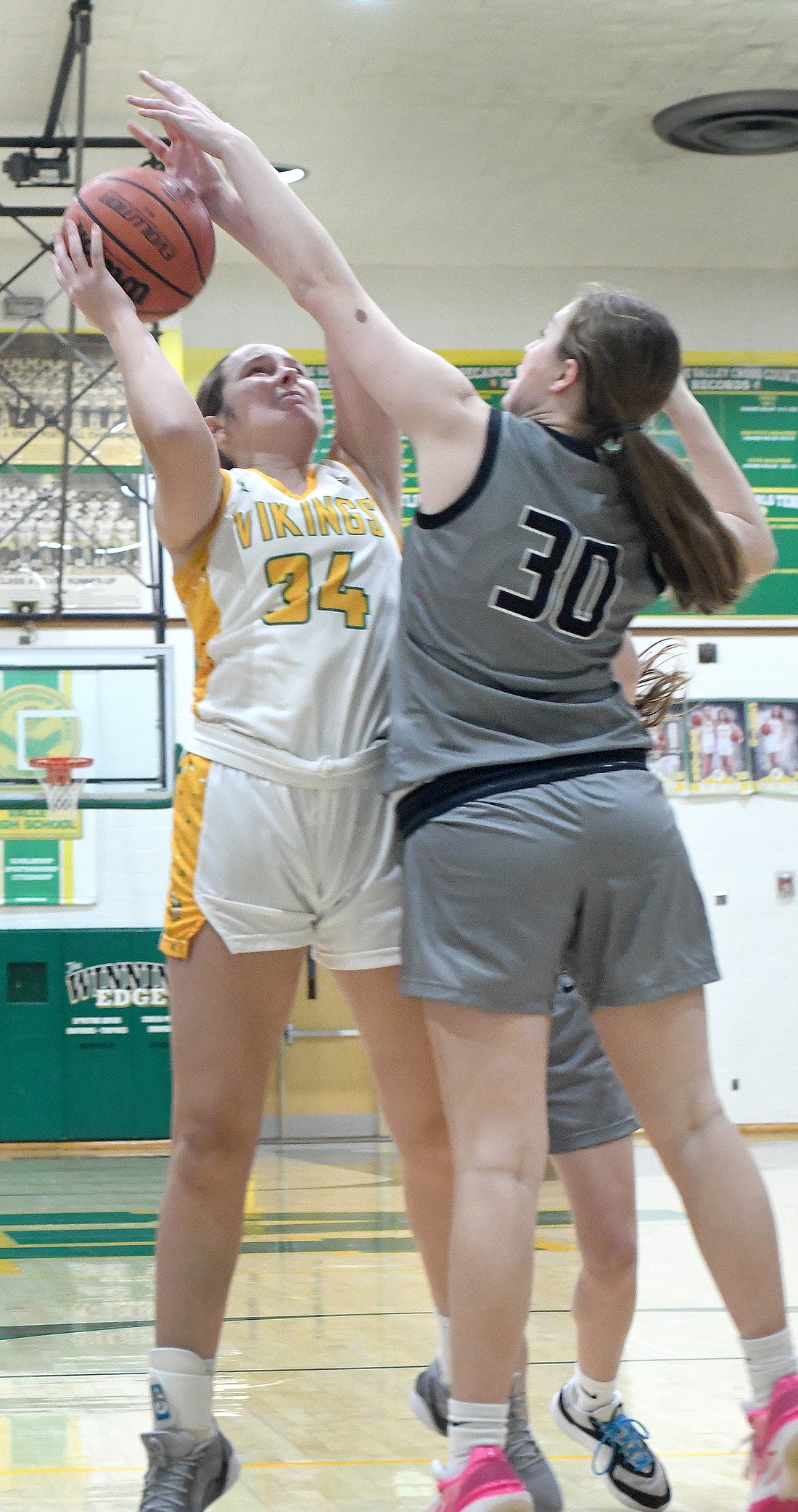 Tippecanoe Valley junior Dalynne Bussard leans back to shoot over Western's Ella Rawlings in the first quarter...NIeter