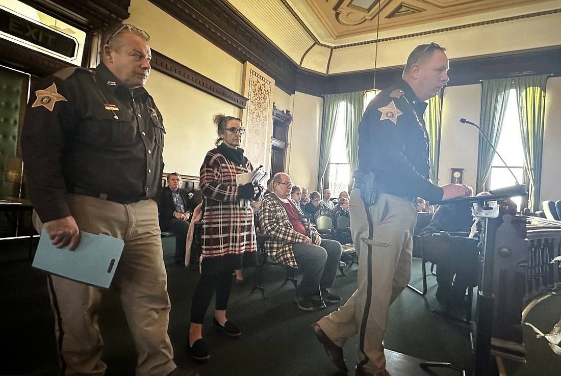 Kosciusko County Sheriff Jim Smith (R), Chief Deputy Chris McKeand and Matron Michelle Hyden present a contract on the jail food service to the Kosciusko County commissioners Tuesday. Photo by David Slone, Times-Union