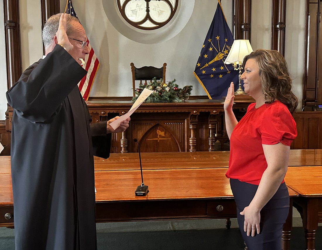 Circuit Court Judge Mike Reed (L) gives new Kosciusko County Council at-large member Rachael V. Rhoades the oath of office Tuesday. Photo by David Slone, Times-Union