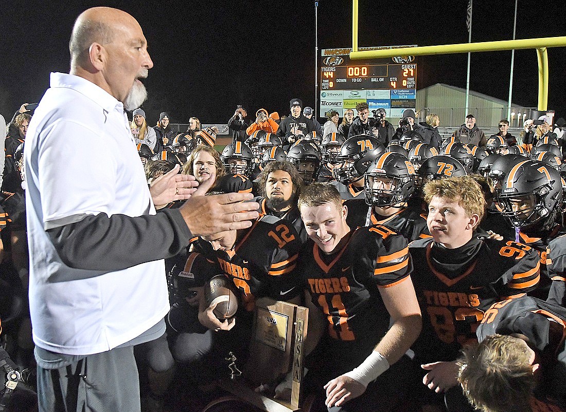 Warsaw head coach Bart Curtis talks with his players after the regional championship win. Photo by Gary Nieter, Times-Union