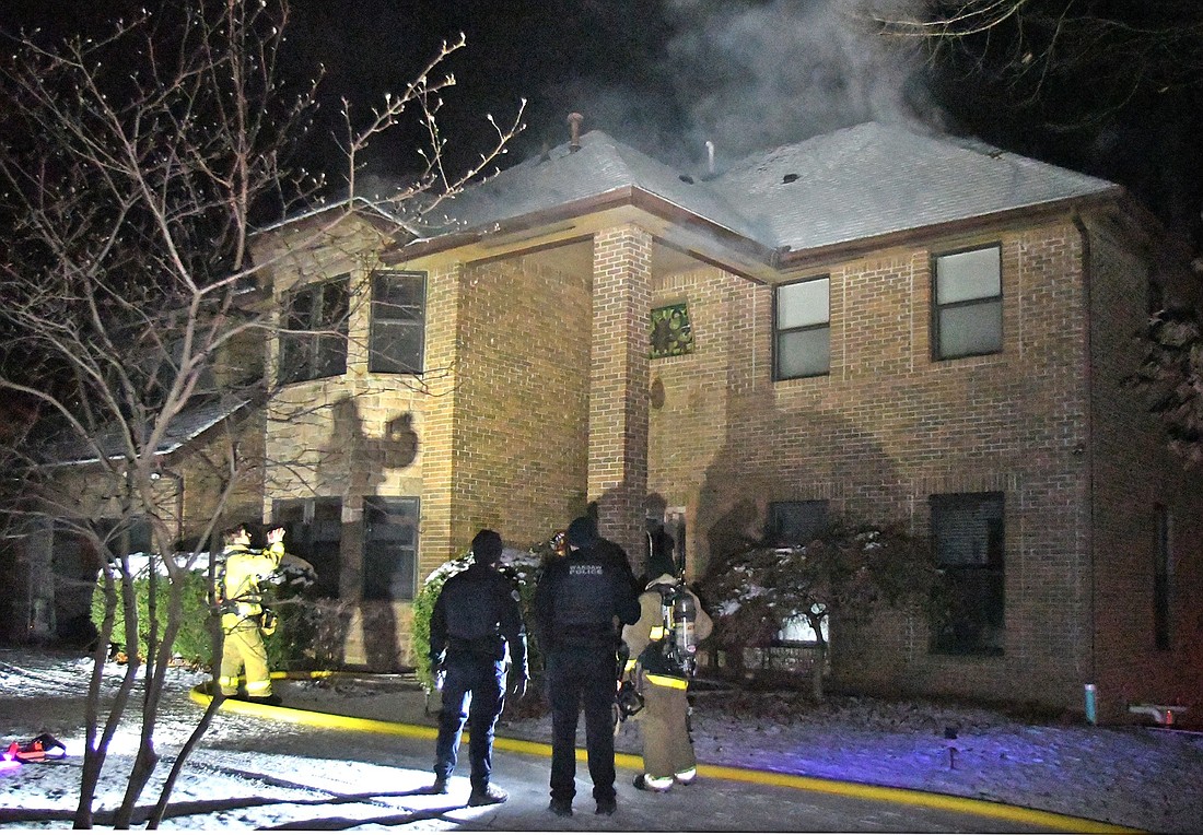 Firefighters were able to quickly knock down early Sunday morning's attic fire at Stone Camp in Winona Lake. Photo by Gary Nieter, Times-Union