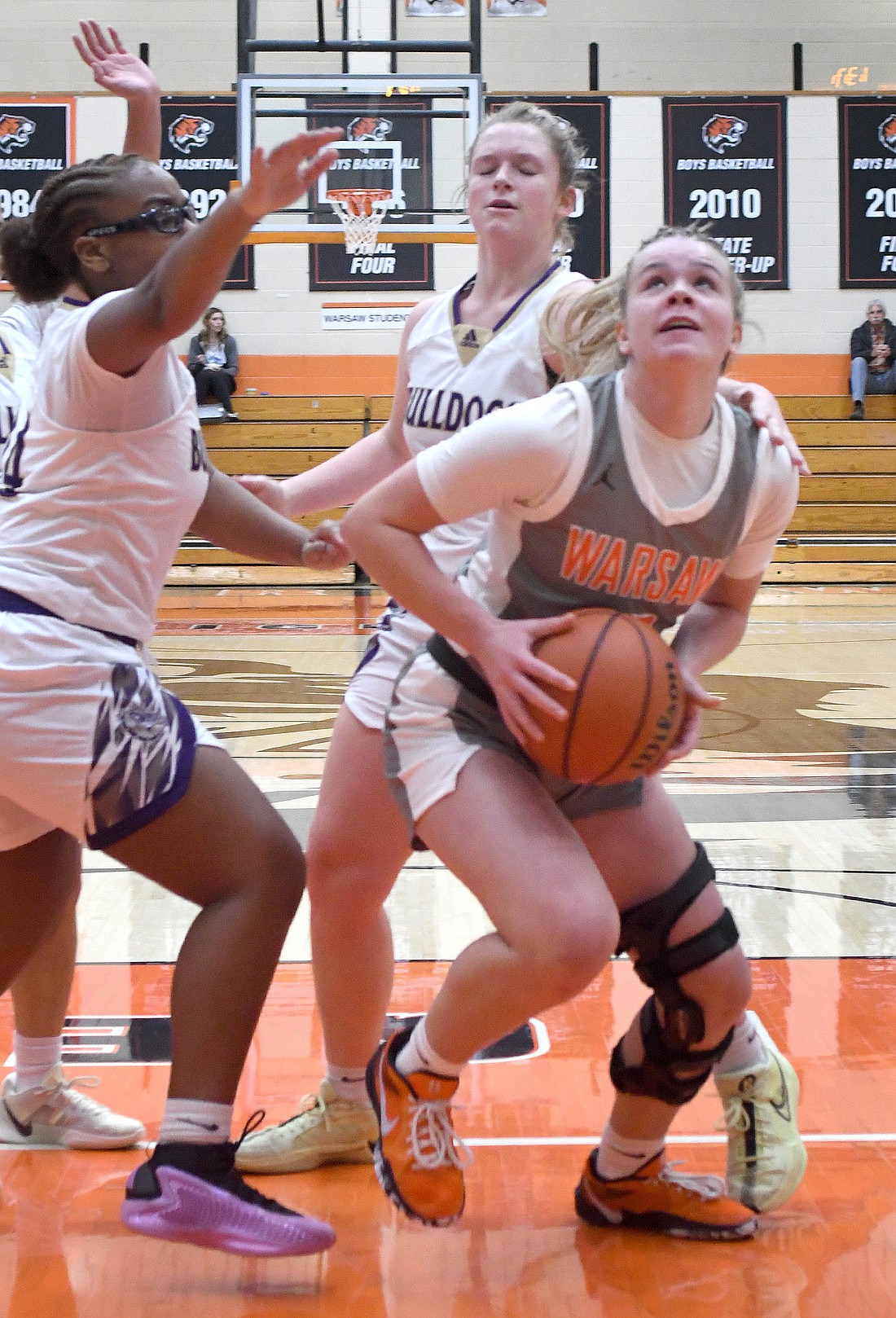 Junior Kyra Kiser of Warsaw scores during the first quarter...Nieter