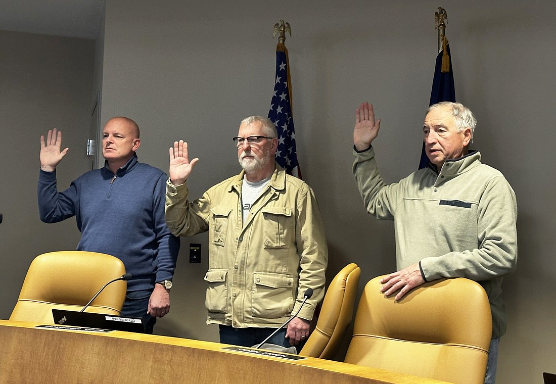 Taking the oath of office Tuesday for the Warsaw-Wayne Fire Territory Board are (L to R) Warsaw Mayor Jeff Grose, David Allbritten and Common Councilman Mike Klondaris. Board members Gordon Nash and Wayne Township Trustee Jeanie Stackhouse were absent. Photo by David Slone, Times-Union