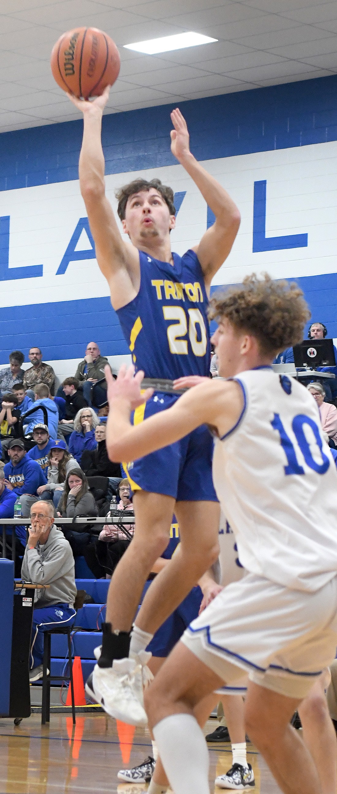 Junior Gage Riffle of Triton elevates for a shot during the first quarter of Tuesday night's game at LaVille...Nieter