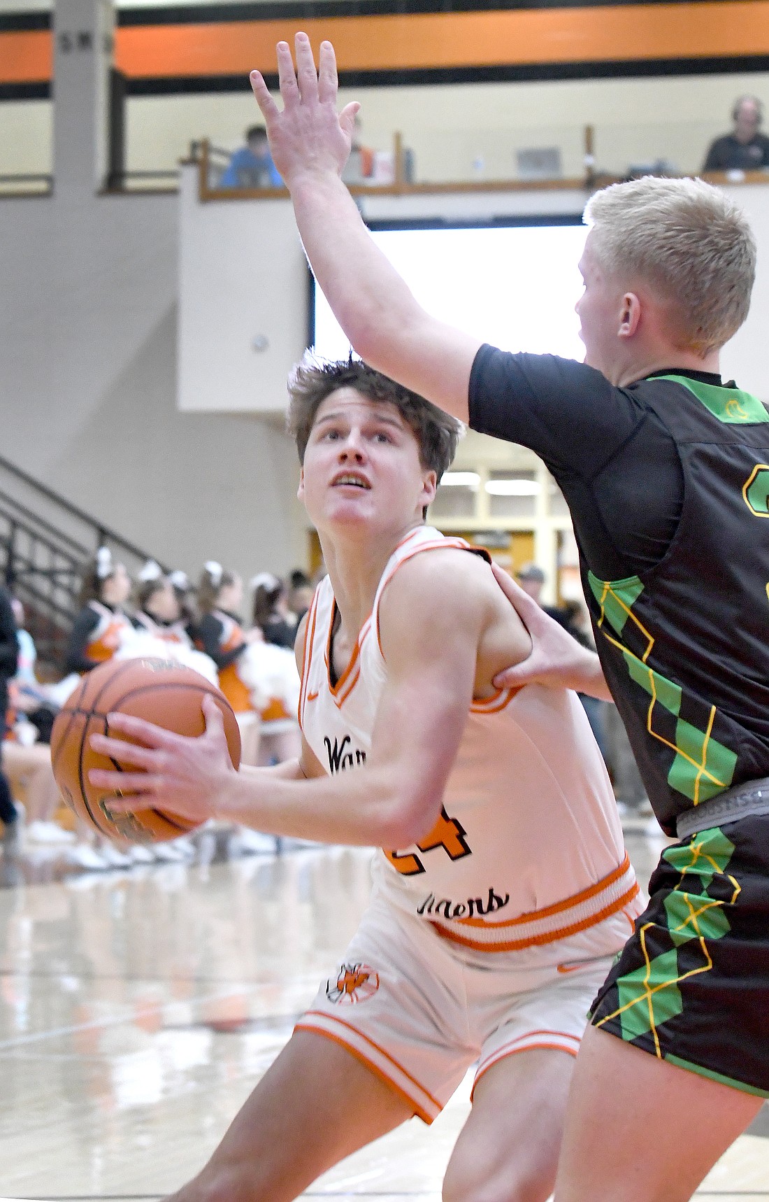 Warsaw senior Carson Gould looks to the basket during the first quarter of Friday night's home game against Northridge...Nieter