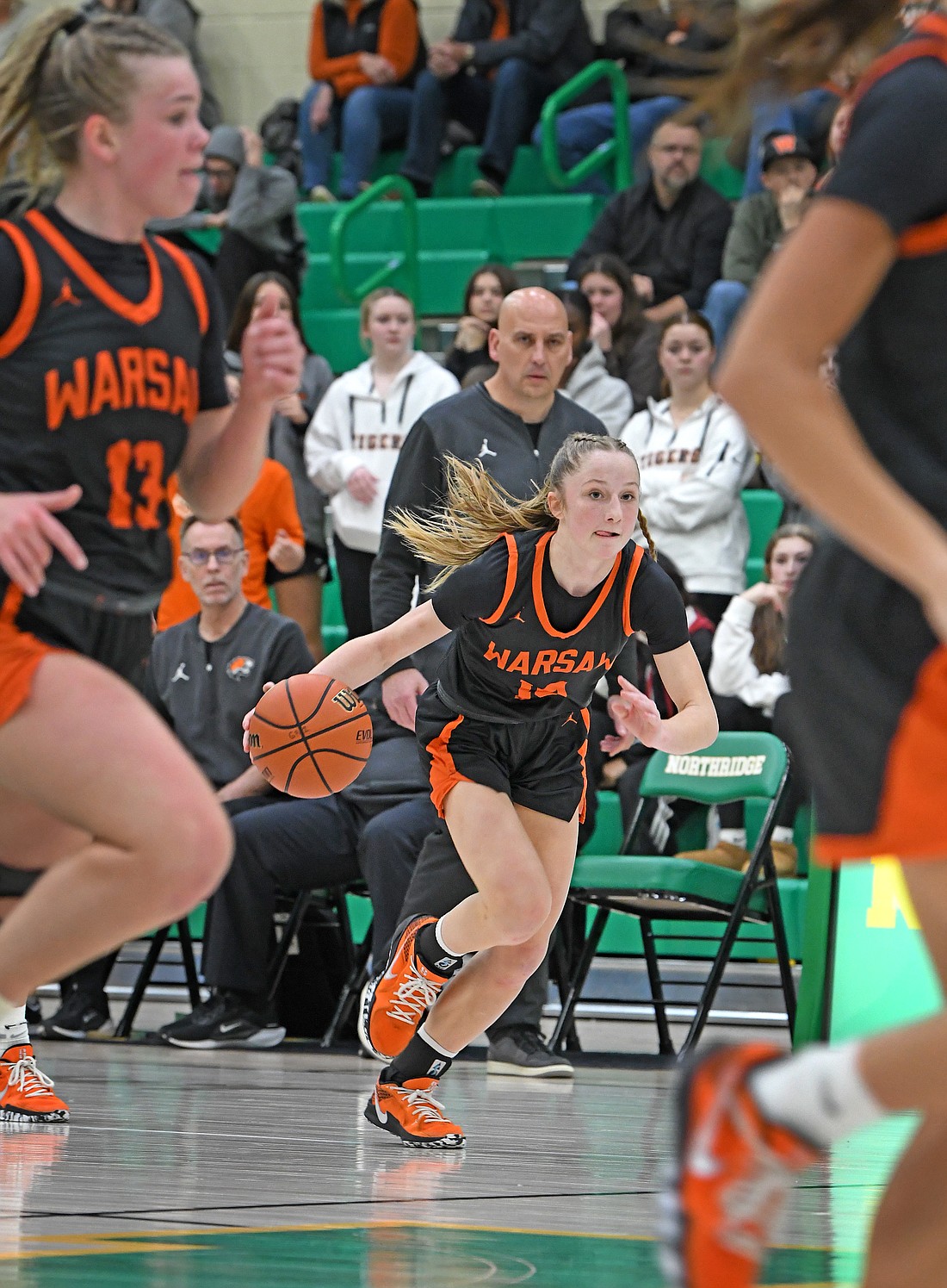 Under the watchful eye of head coach Lenny Krebs, junior Joslyn Bricker runs the court during Saturday's game at Northridge...Nieter