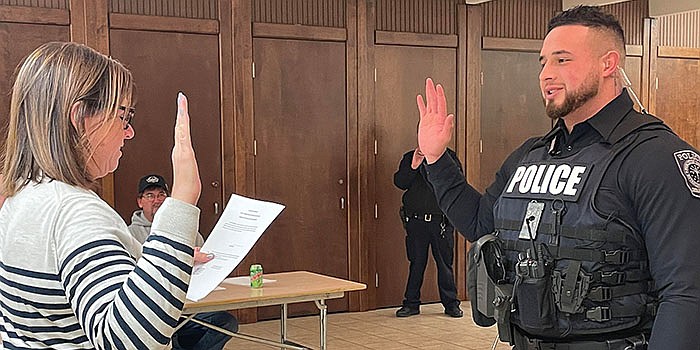 Pierceton town attorney Tammy Keirn swears in Alex Morrison as a deputy marshal for Pierceton Police Department. Photo by Liz Adkins, InkFreeNews