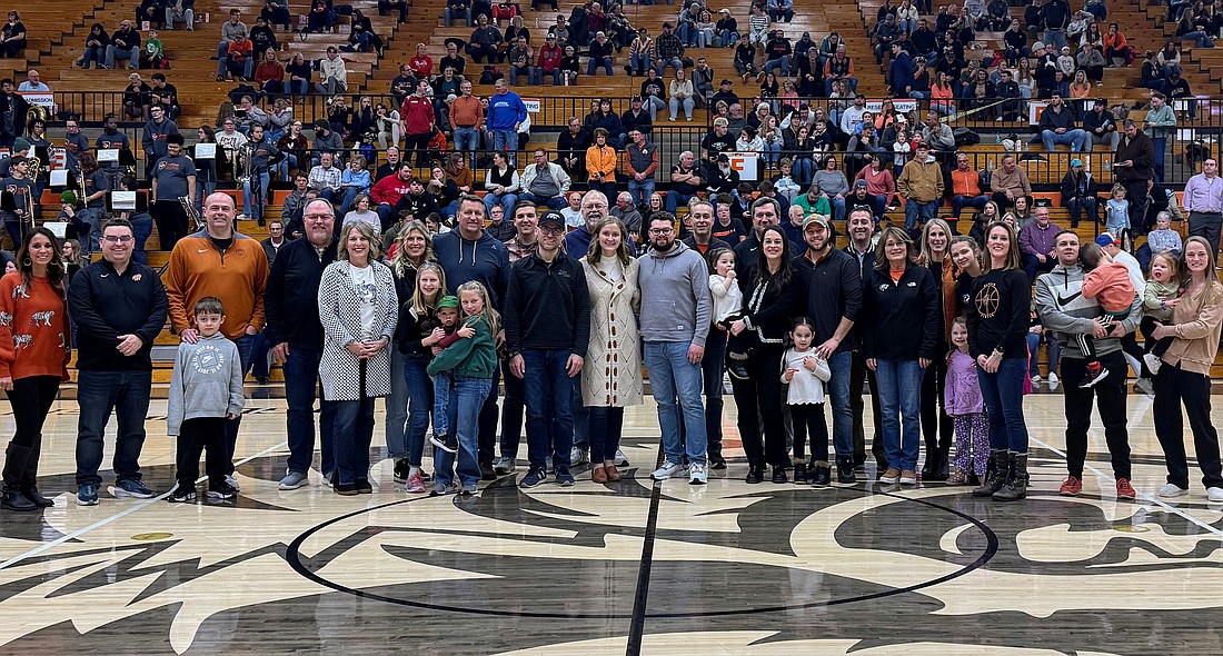 Warsaw Community Schools administrators Dr. David Hoffert, Tracy Horrell, Kyle Carter, April Fitterling and Krista Polston join Warsaw School Board members Heather Reichenbach, Randy Polston and Matt Deuel to recognize Jerry and Steve Yeager and the SYM Financial team. Photo Provided.