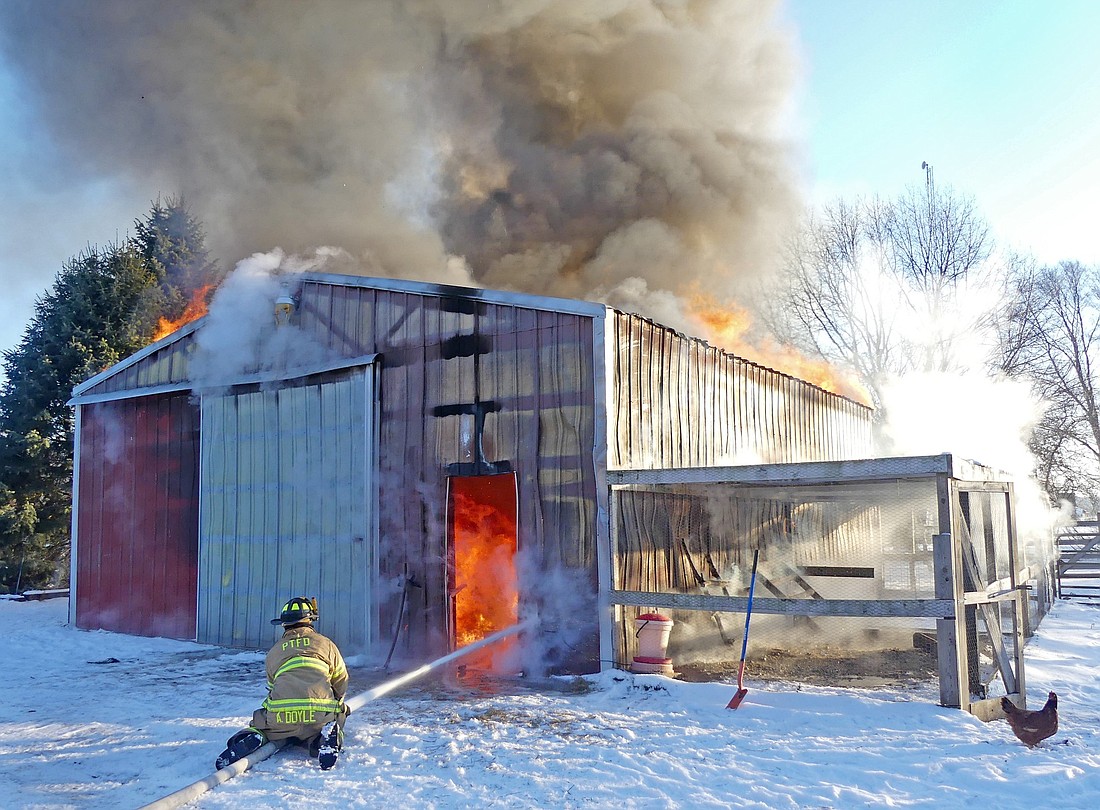 Several area fire departments responded to Wednesday morning's barn fire on 8 Square Road. Photo by Gary Nieter, Times-Union