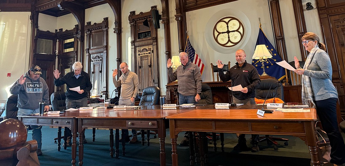 (L to R) Mike Loher, John Hall, Lyle Schrock, Mark Skibowski, Matt Metzger and Kathy Ray take their oaths of office. Photo by Madison Hart, InkFreeNews