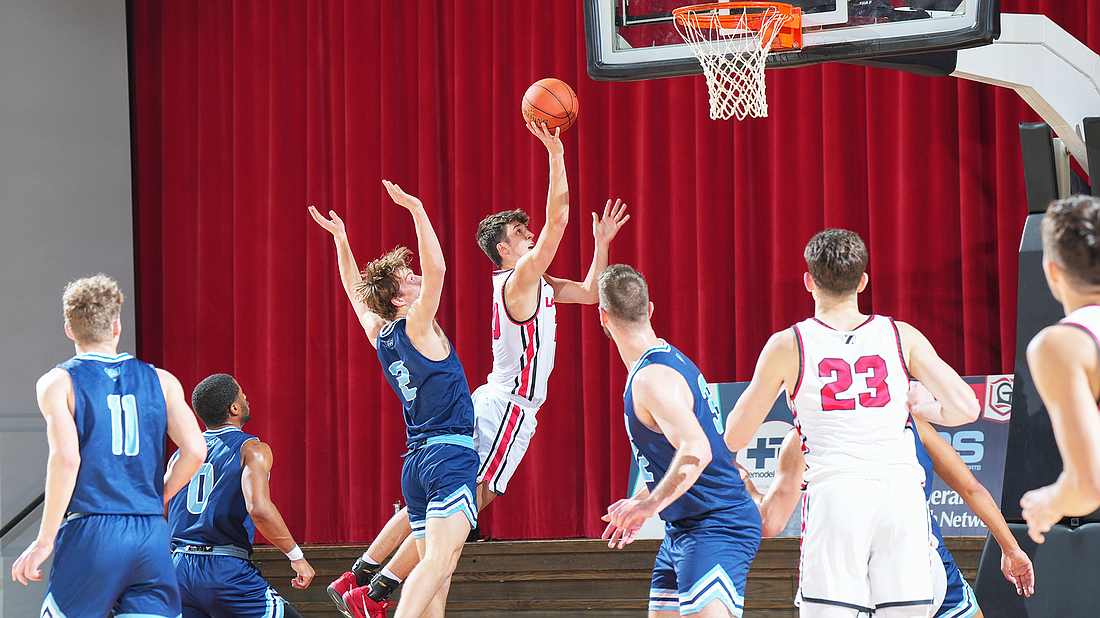 Pictured is Hunter Walston rising for a layup during Grace's win over Mt. Vernon Nazarene on Saturday.