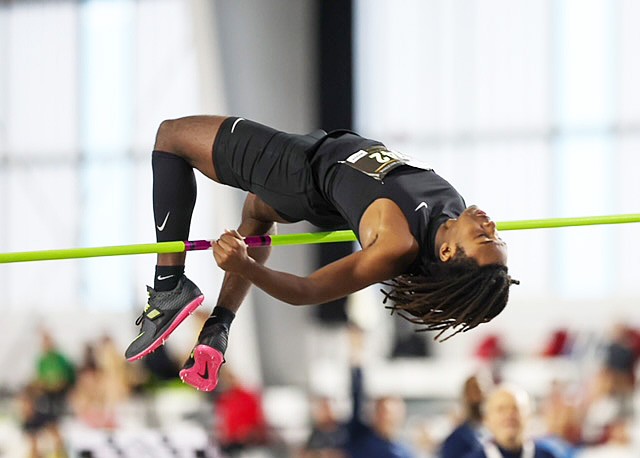 Warsaw junior Jordan Randall clears the bar during a high jump competition in Louisville.