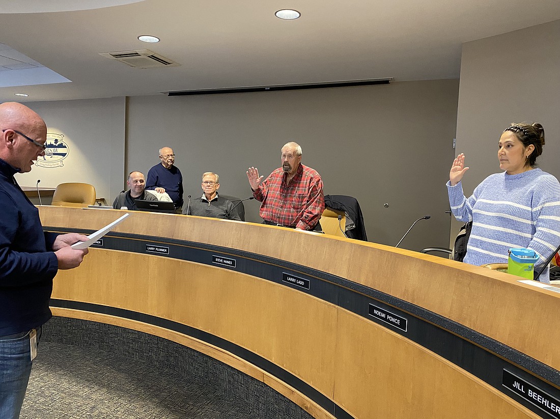 At the Warsaw Parks and Recreation Board meeting on Tuesday, Warsaw Mayor Jeff Grose (L) swore in Noemi Ponce (R) and Steve Haines (center in the red shirt) for new terms on the board. Next to Haines (L to R) are  Warsaw Parks and Recreation Department Maintenance Director Shaun Gardner, Board Vice President Larry Ladd and Warsaw Parks and Recreation Department Superintendent Larry Plummer. Photo by Leah Sander, InkFreeNews