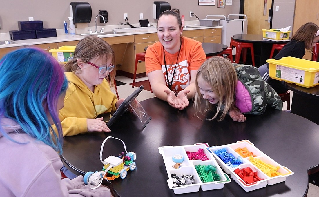 Grace College’s elementary education students volunteer at Girls in STEM club, an after-school program for first through third-grade girls at Madison, Washington and Jefferson Elementary Schools. Photo Provided